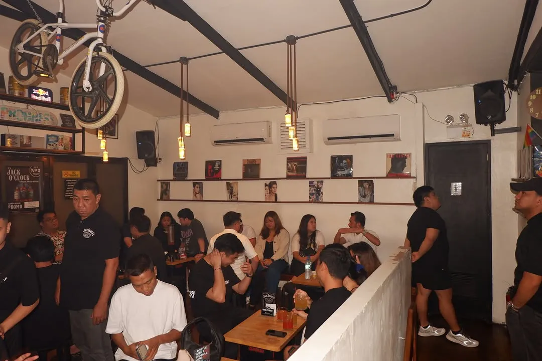 Long upstairs dining room filled with groups at tables
