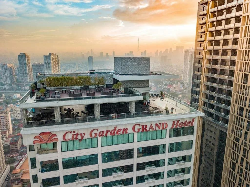 Firefly's rooftop terraces above City Garden Grand Hotel at sunset