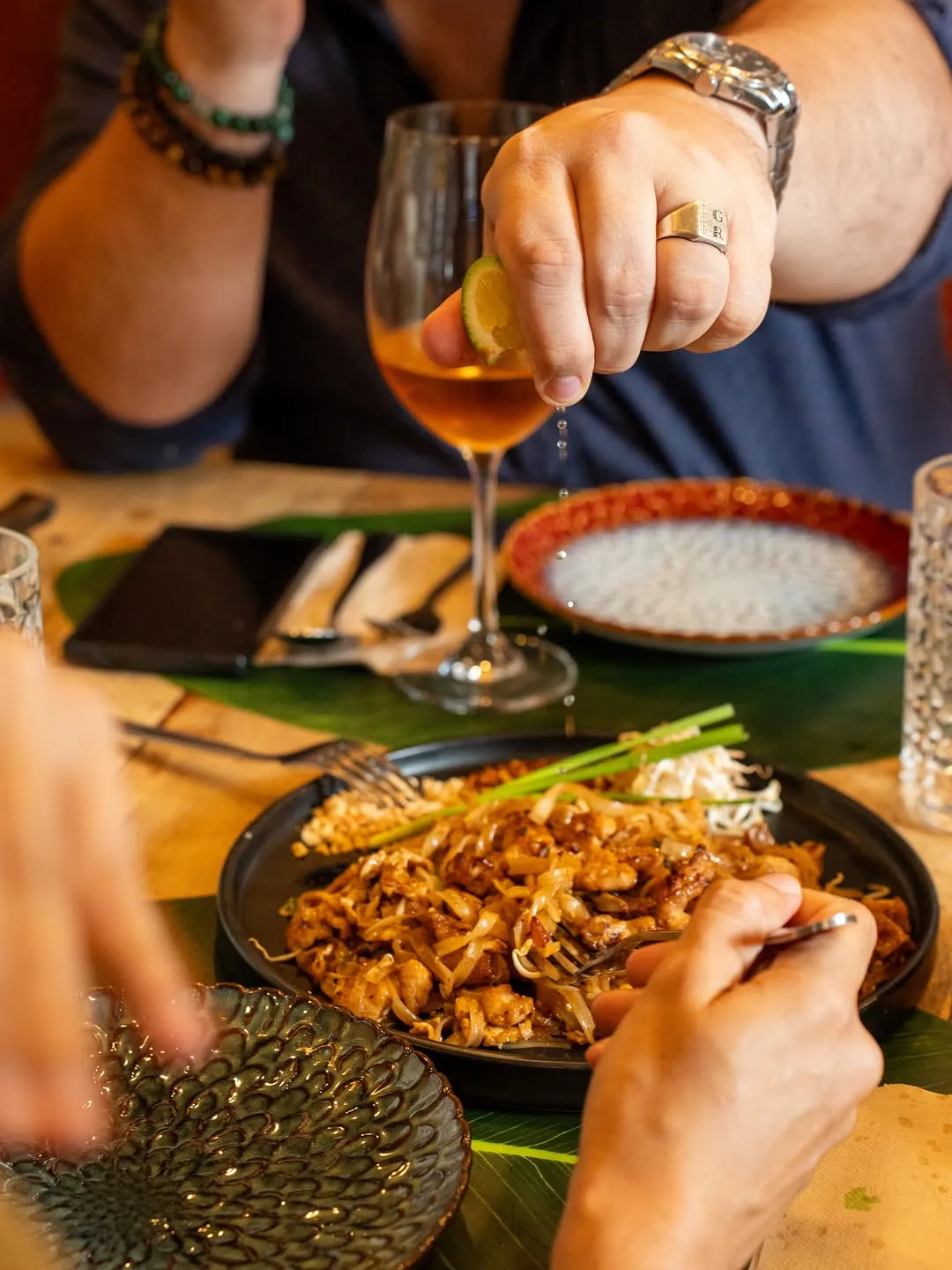 Plate of Pad Thai with lime and chopsticks