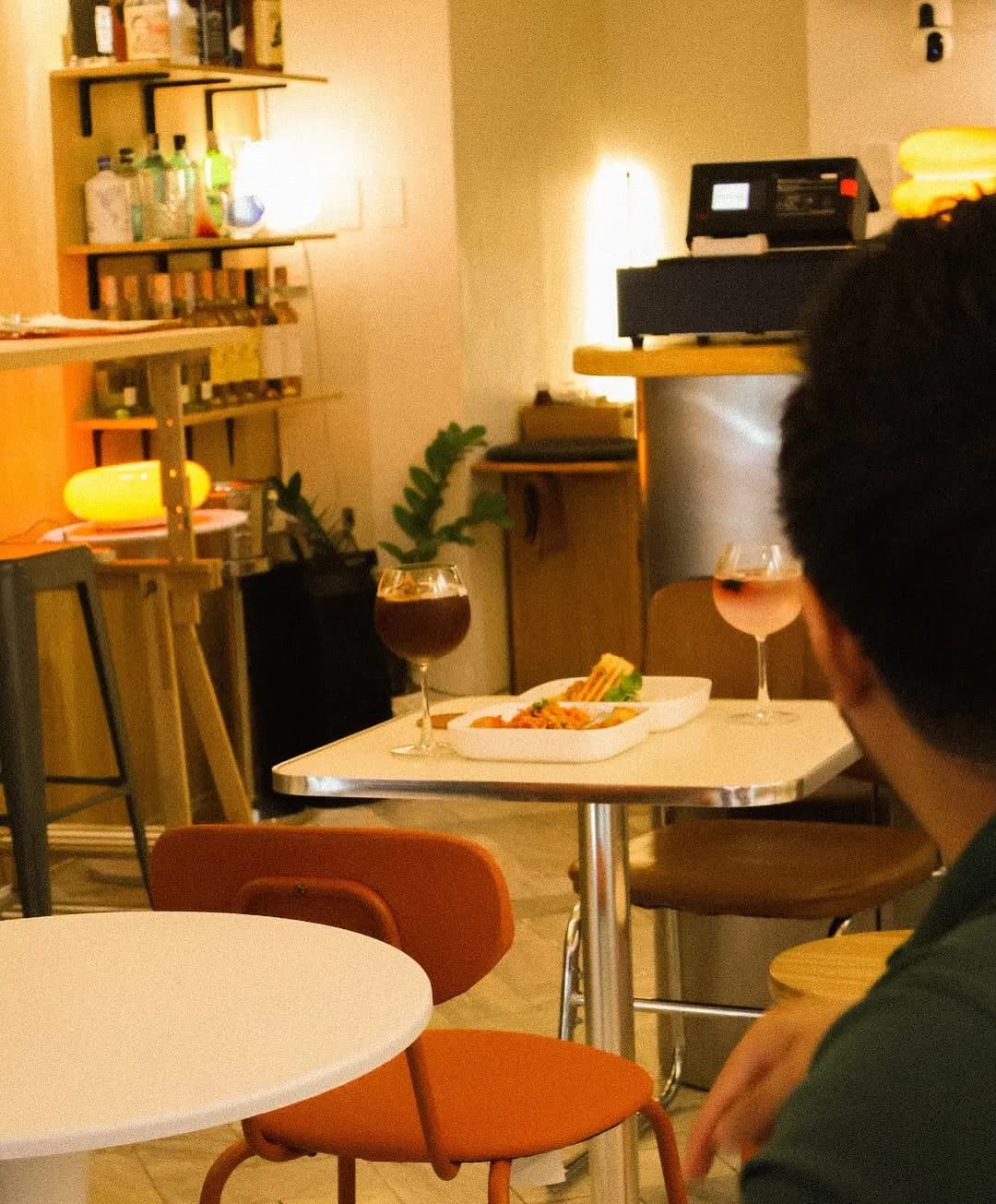 Small cream-and-orange café dining room