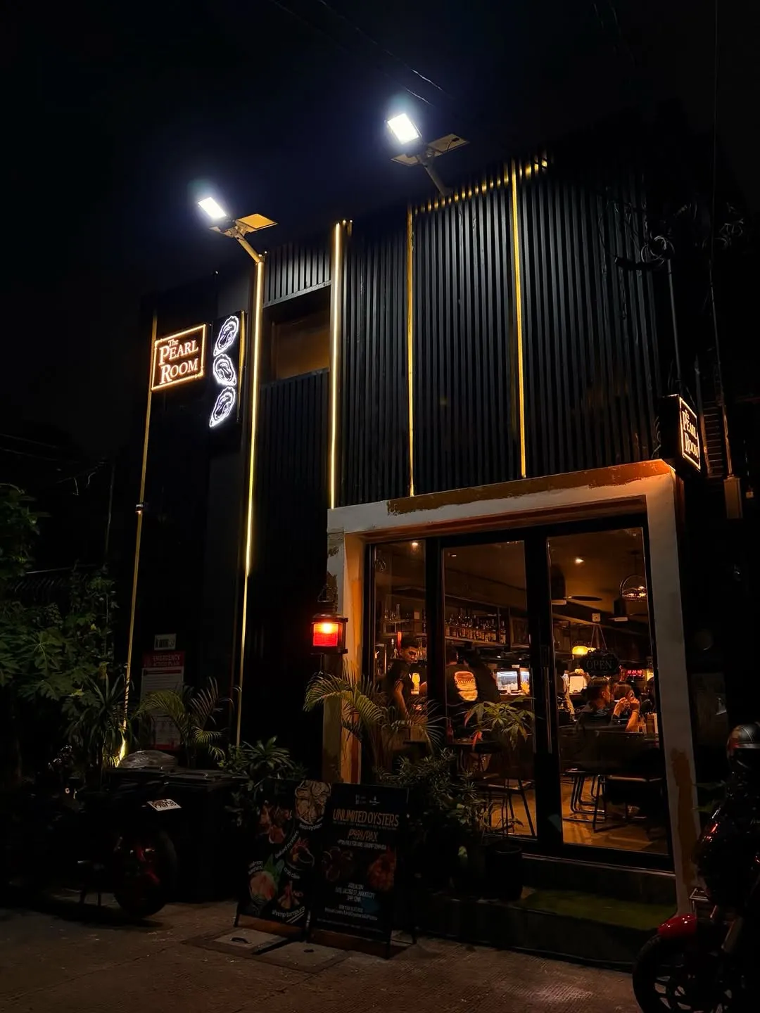 The Pearl Room Poblacion entrance and dining room lit after dark