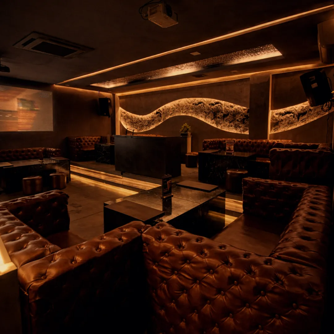 Executive lounge with leather seating and warm lights