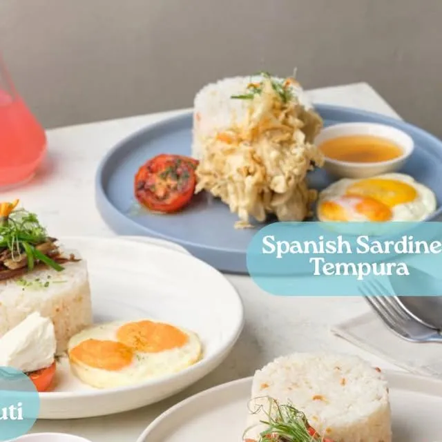 Breakfast plates with rice, eggs and Spanish sardines tempura