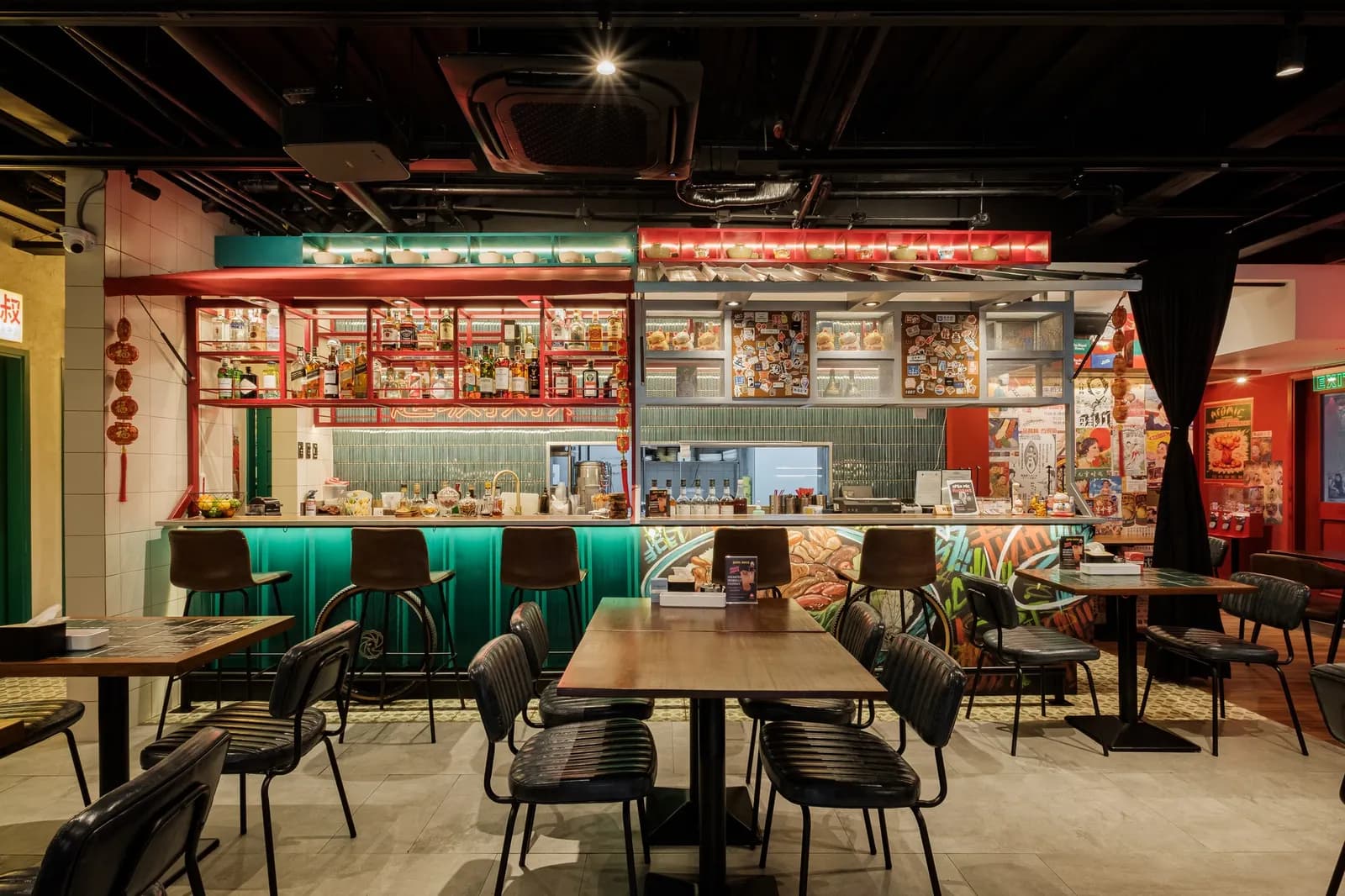 Retro dining room with green booths and an open bar counter