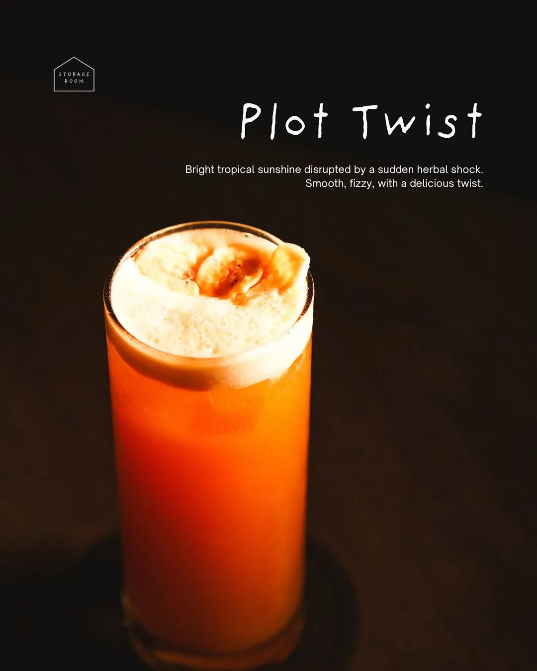 Tall orange house cocktail on a dark bar