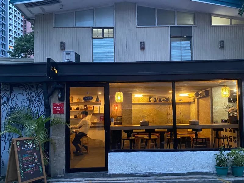 La Pita storefront glowing on Don Pedro Street