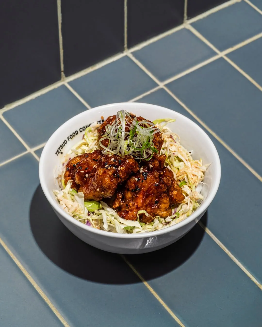 Teriyaki chicken bowl with rice and greens