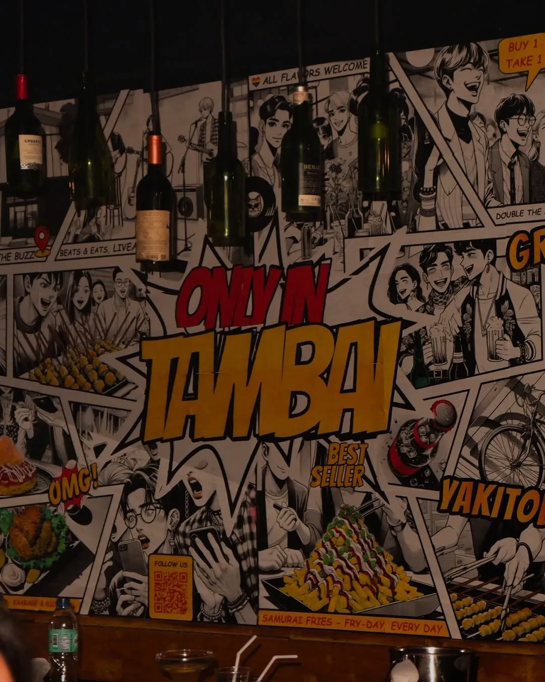 Tambai mural covering the wall beside the bar