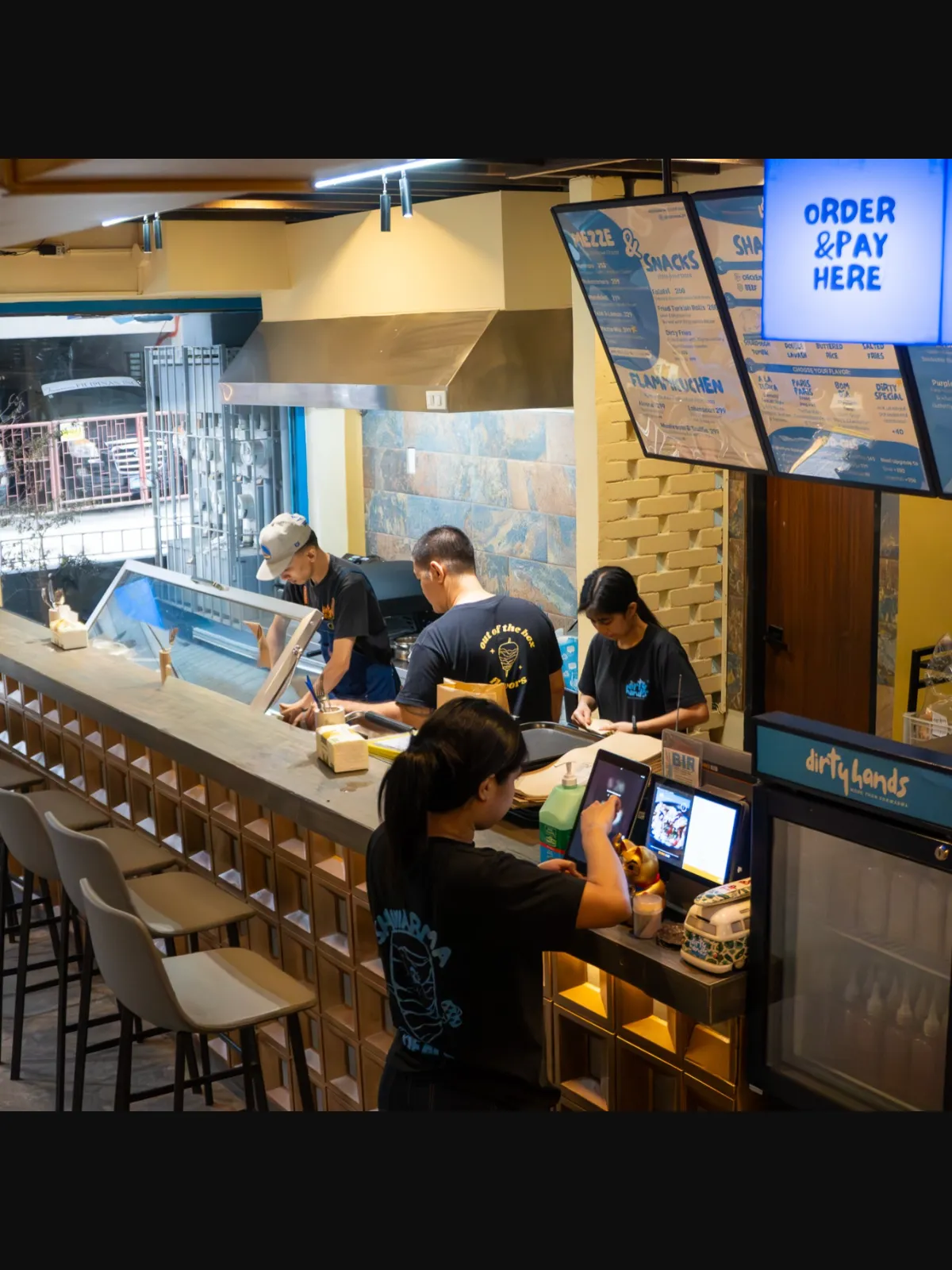 Open kitchen and counter seating inside the new Dirty Hands space