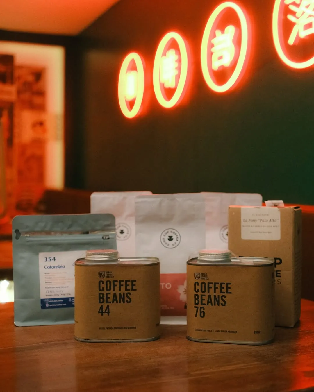 Cold brew bottles and coffee cups inside the café