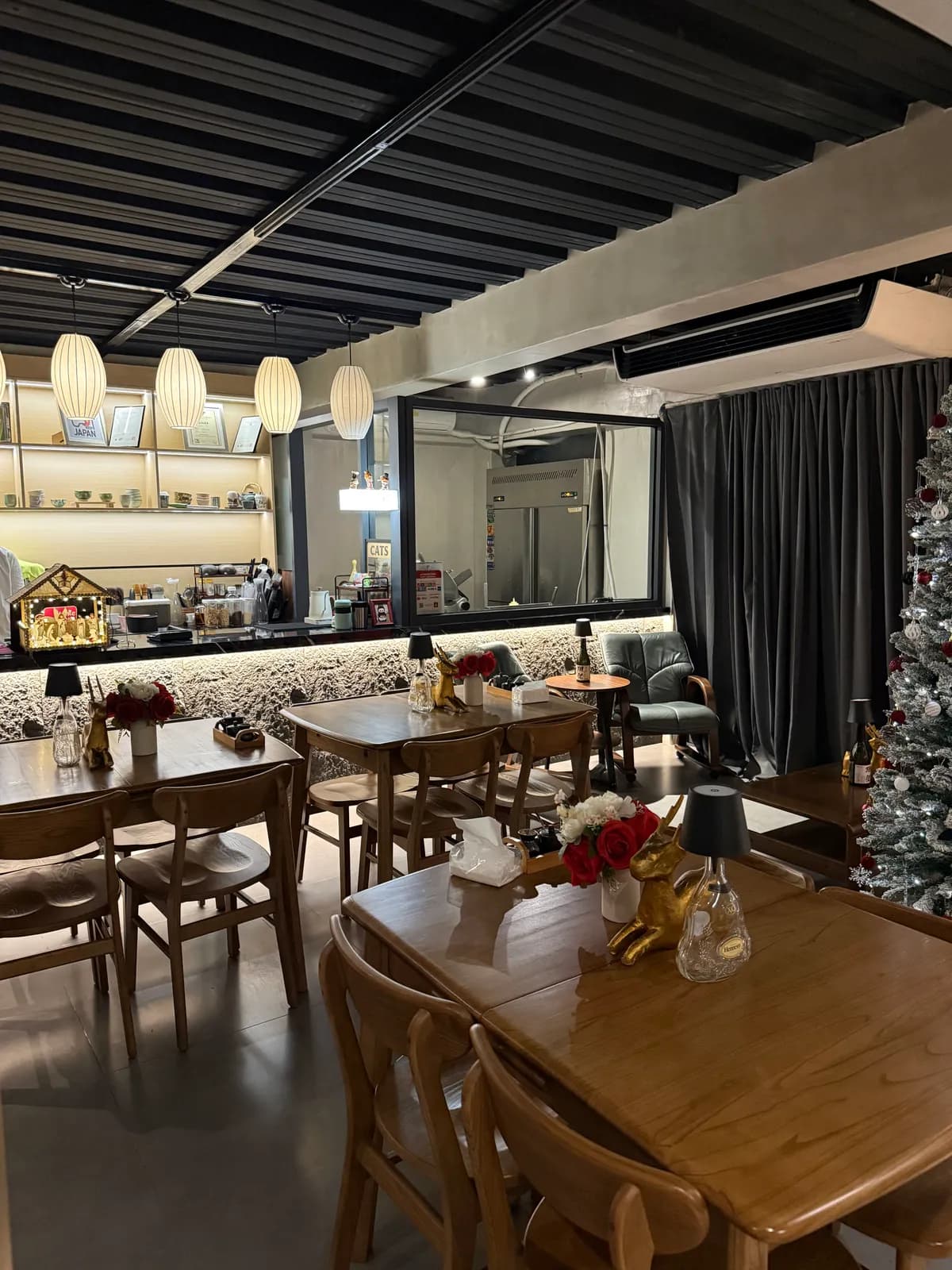 Wood-lined dining room and matcha counter with empty tables