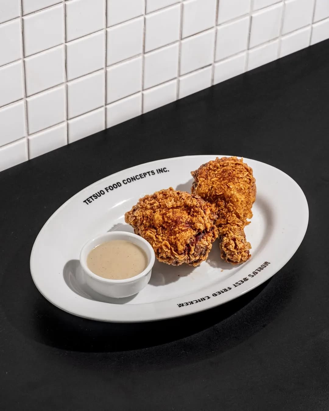 Crisp fried chicken pieces with a dipping sauce