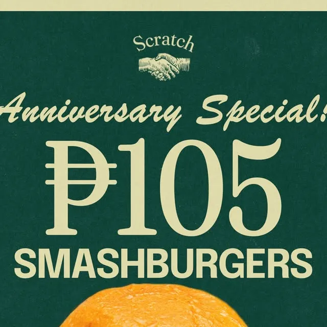 Two stacked smashburgers with melted cheese and crisp-edged beef patties.