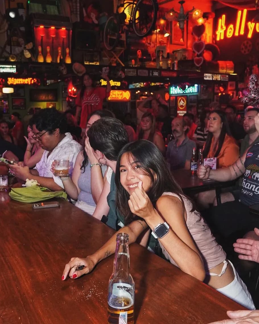 Crowd seated around tables during a live band night